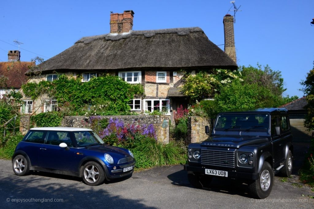 A typically English house with two typically English cars outside (well, the manufacturers are no longer English)