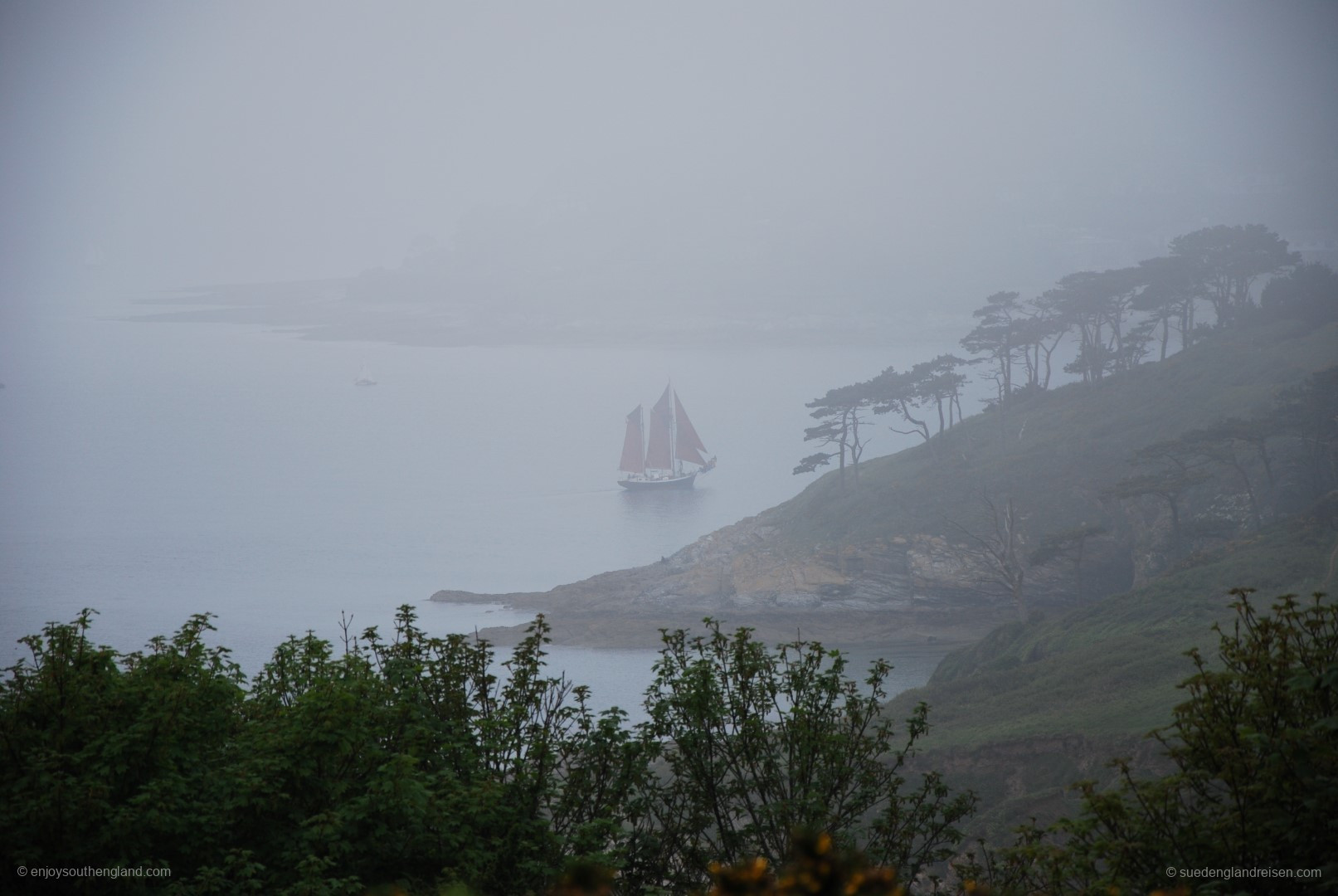 This is not a mirage or a jump back in time: Old sailing ship off the coast of The Roseland Peninsula in the fog
